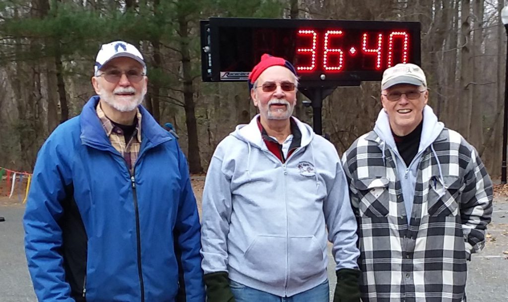 A combined 49 years of experience retired at the Anniversary Run.  Above are Al Stott, Bob Burash, and Whitey Gross  at 36 minutes and 40 seconds into their last race as finish line crew.  